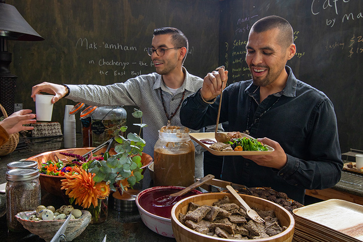 Vince Medina and Louis Trevino serve food to their guests at Café Ohlone.
