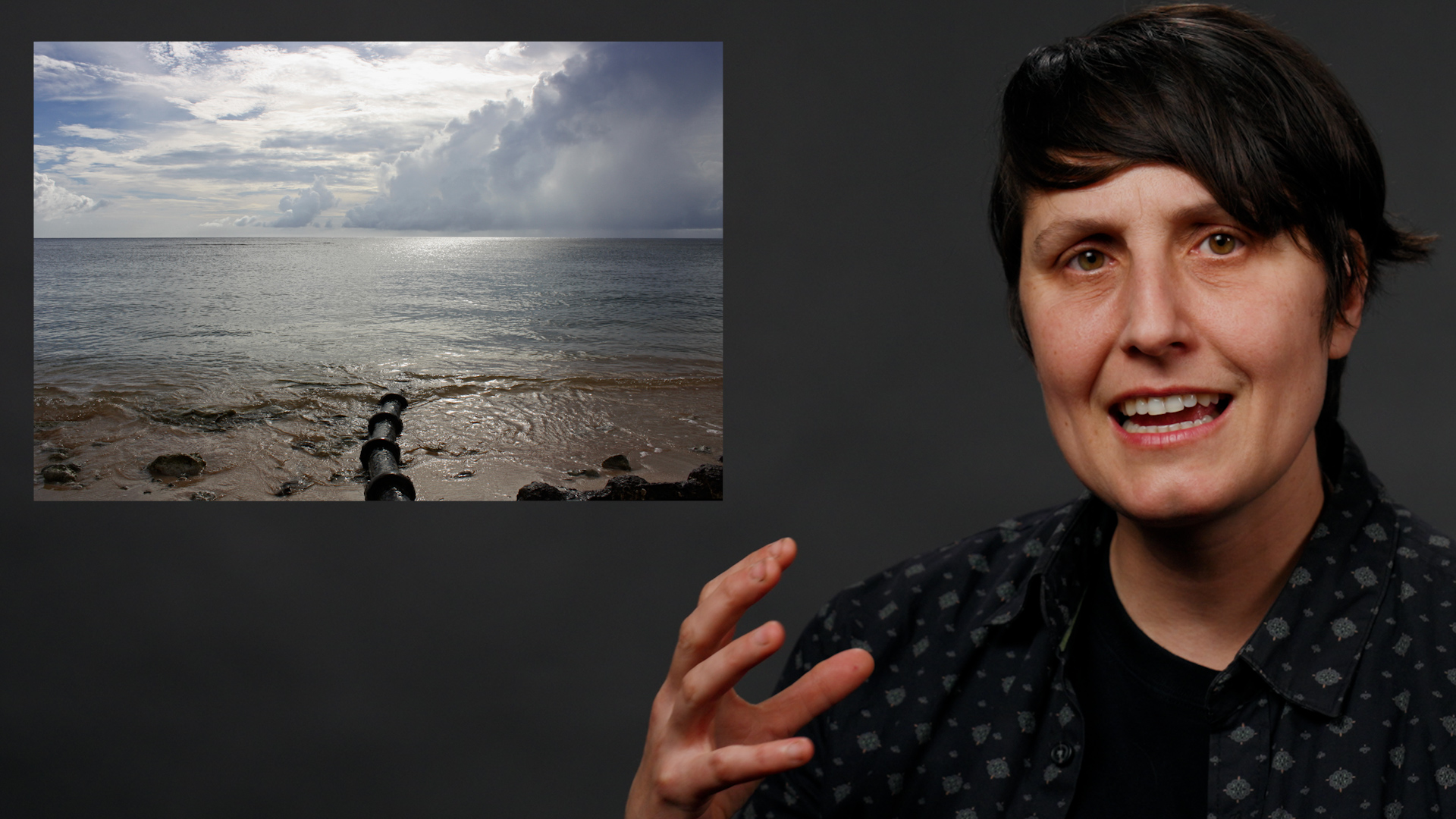 A woman on a gray background with an inset image of an armored cable going into the ocean.
