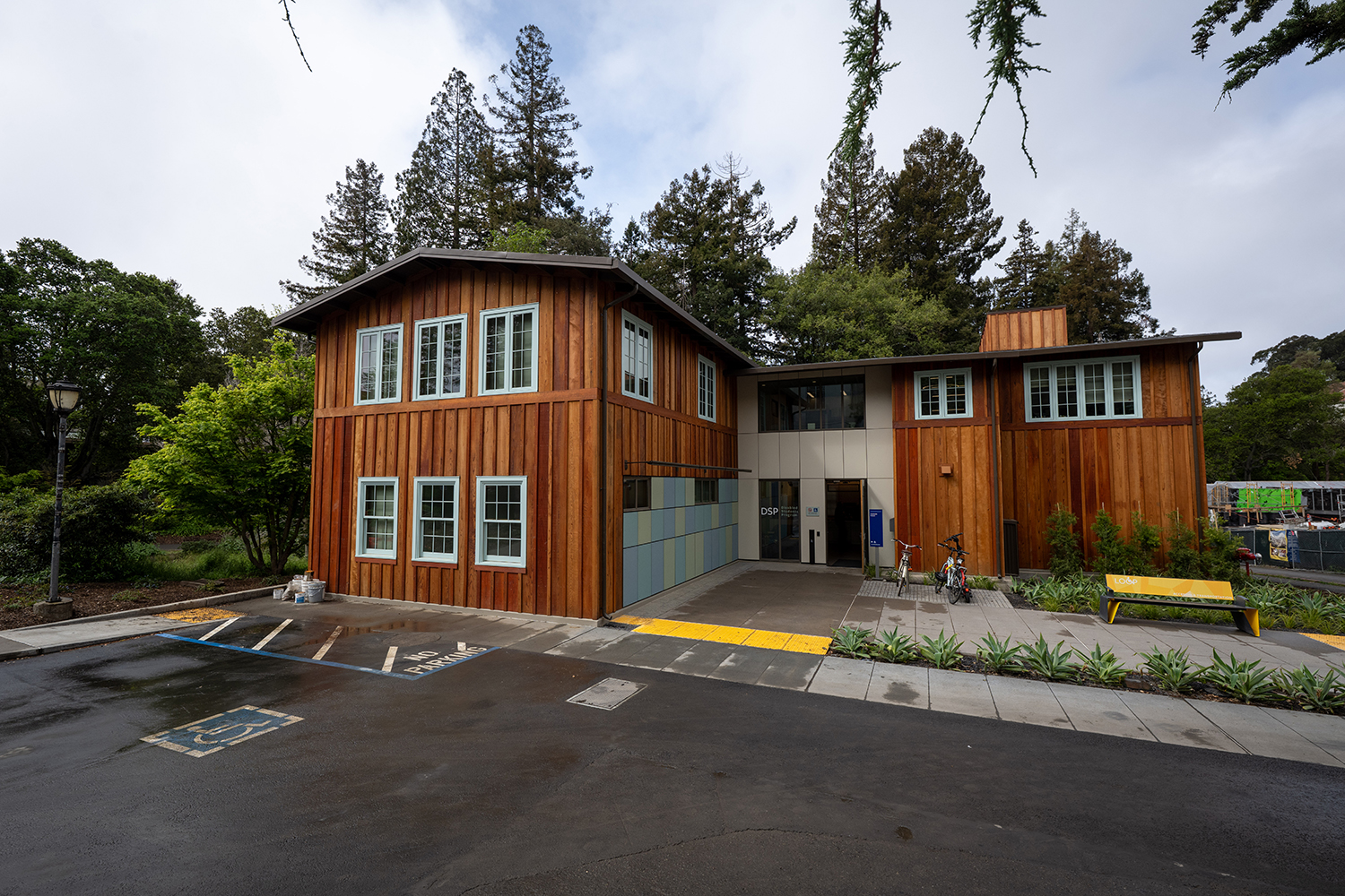 Creekside Center, the new home of the Disabled Students' Program, is a building that was designed in 1920 by campus architect John Galen Howard. When it was renovated, the two-story wood frame building retained its wood plank exterior walls and windows with tiny square panes.
